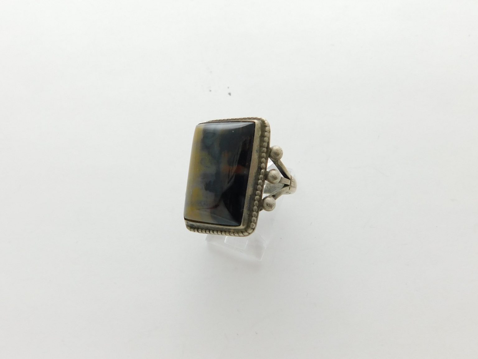 Side view of Yellow & Black Petrified Wood and Sterling Silver Fred Harvey Ring