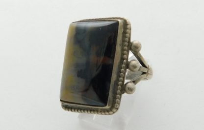 Side view of Yellow & Black Petrified Wood and Sterling Silver Fred Harvey Ring