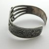 Side view of Fred Harvey Arrow Novelty Company Navajo Turquoise and Sterling Silver Thunderbird Bracelet
