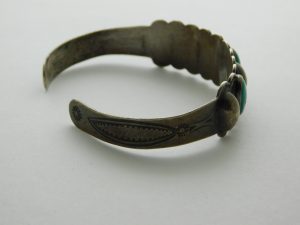 Side view of Indian Handmade Coin Silver and Cerrillos Turquoise Fred Harvey Bracelet