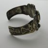 Side view of Fred Harvey Repousse' Thunderbird, Arrow, and Cerrillos Turquoise Sterling Silver Bracelet